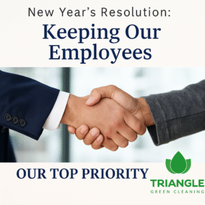 Close-up of two hands shaking, representing teamwork and appreciation, with text reading “New Year’s Resolution: Keeping Our Employees Our Top Priority” and the Triangle Green Cleaning logo.
