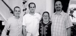 Triangle Green Cleaning leadership team poses together at 518 West Italian Café during their farewell lunch, honoring their roots and shared beginnings.