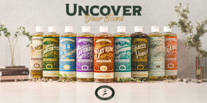 Lineup of Carolina Castile Soap bottles in a variety of scents, displayed with natural décor.