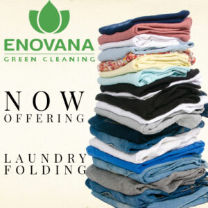 Stack of folded laundry with Enovana Green Cleaning logo promoting laundry folding service