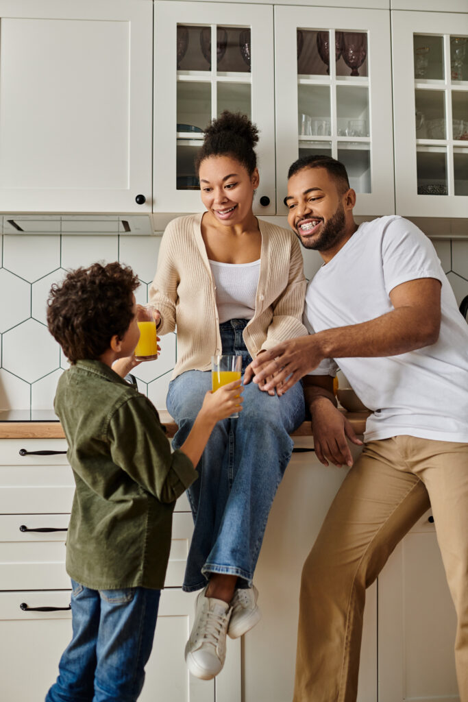 Family gathered in a spotless kitchen after a deep cleaning by Enovana Green Cleaning in Raleigh, NC—enjoying healthy, happy moments together.