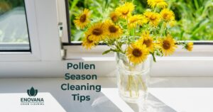 Yellow flowers in a clear vase on a sunlit windowsill, featured image for Enovana Green Cleaning's pollen season cleaning tips blog post