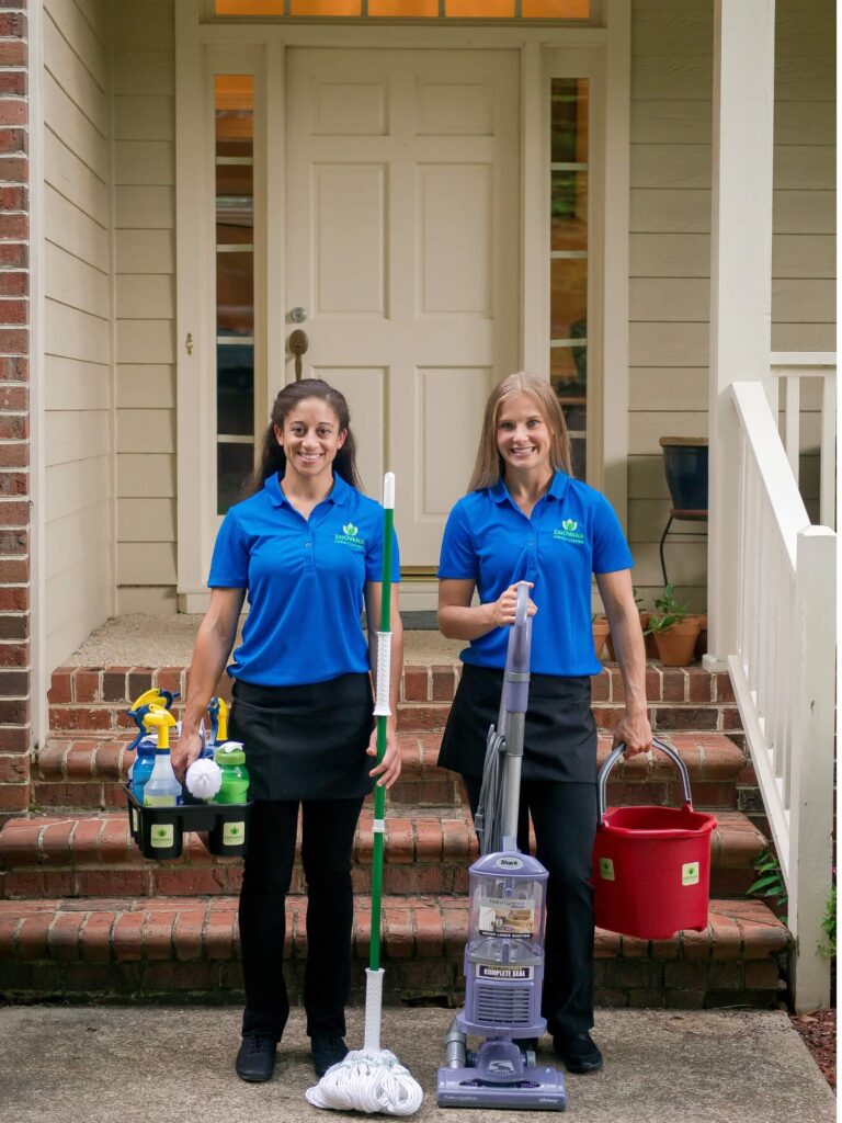 Enovana Green Cleaning professionals arriving at a Raleigh-area home with eco-friendly cleaning supplies
